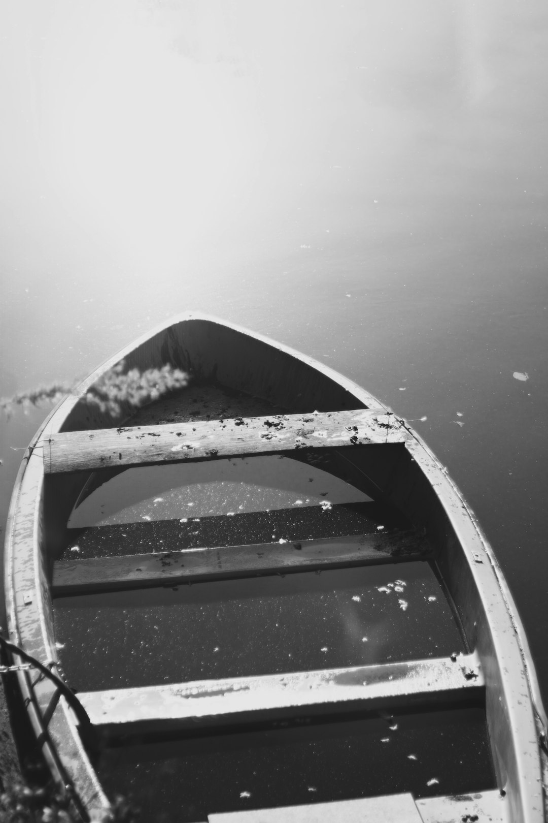 grayscale photo of boat on water