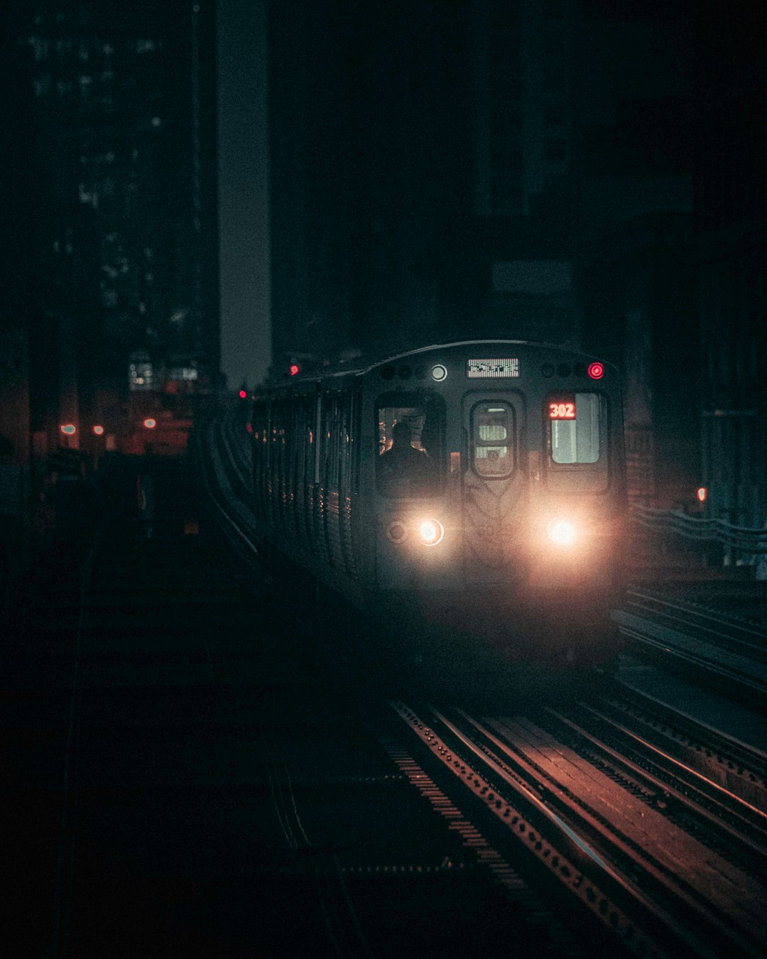 train on rail during night time