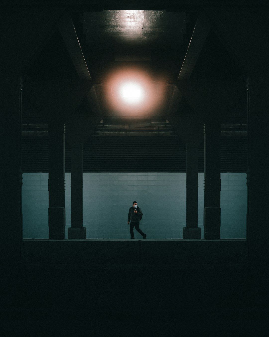 woman in black dress standing on hallway