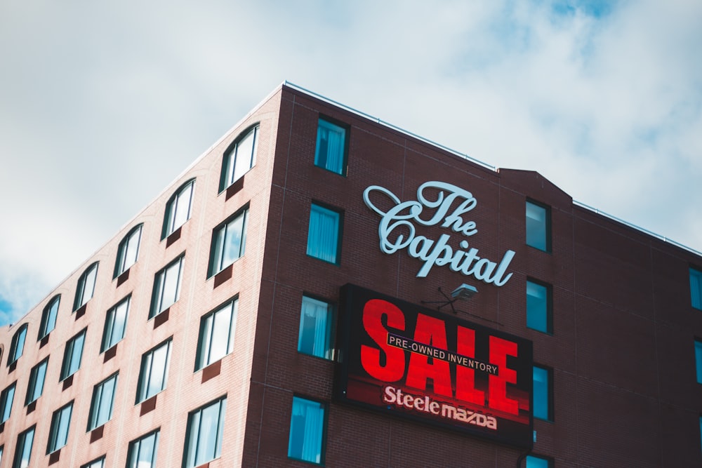 a building with a sign that says the capital sale