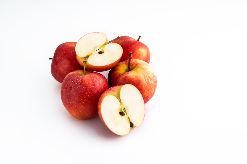 3 red apples on white background