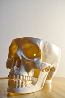 yellow and white ceramic figurine