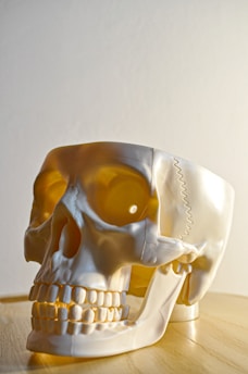 yellow and white ceramic figurine