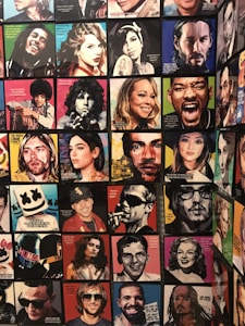 A collection of colorful, pop art-style portraits depicting various famous individuals, each with a distinct color scheme and artistic text quotes overlaying the images. The arrangement includes a vibrant mix of contemporary and classic figures, with each portrait emphasizing facial expressions and unique stylistic representations.