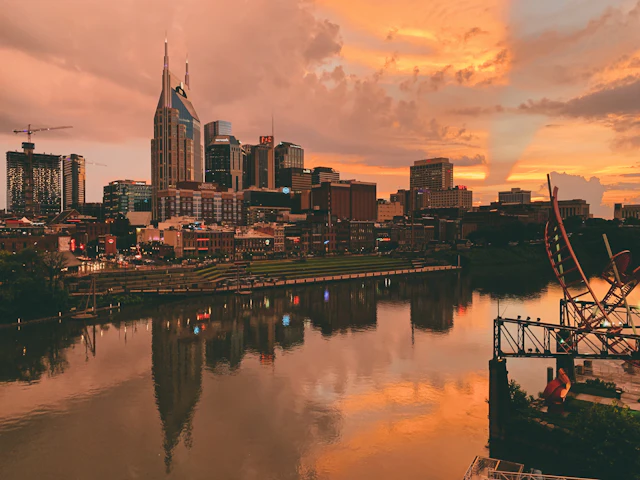 Nashville skyline over the Cumberland River at sunset