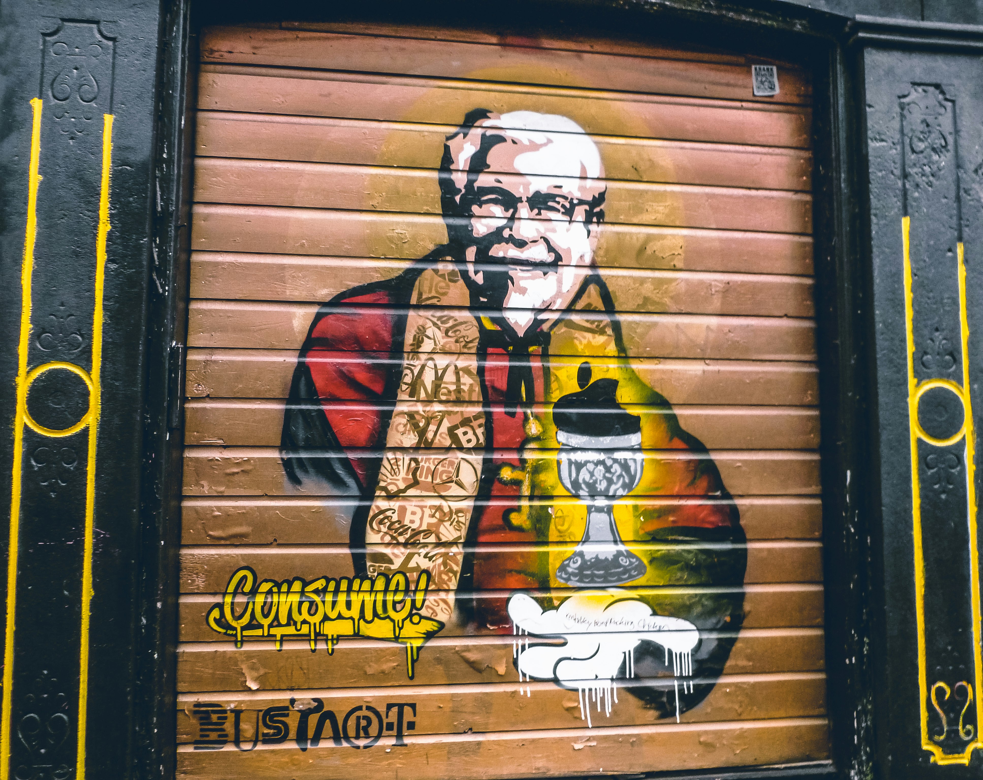 man in black and red scarf and black sunglasses graffiti