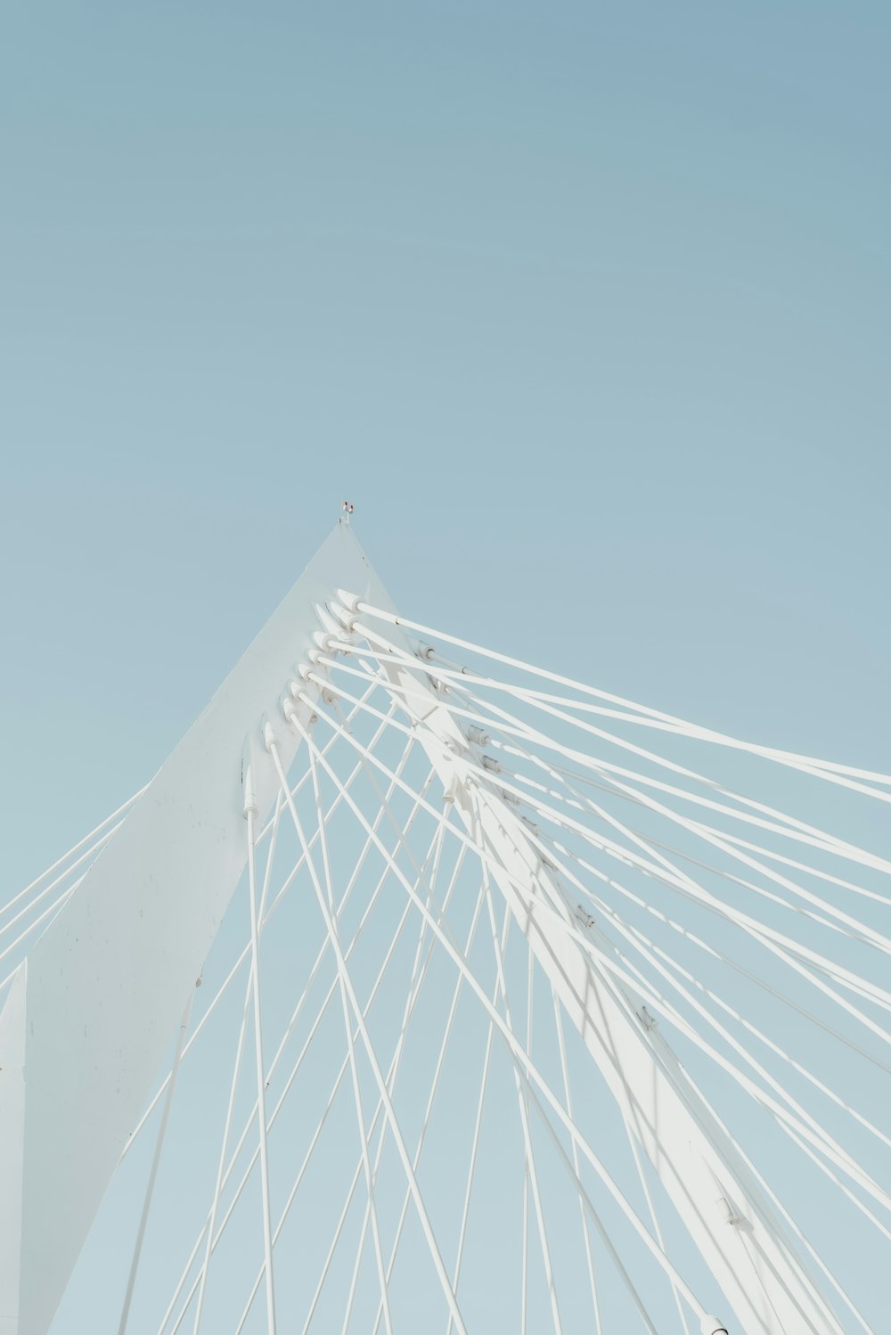 white bridge under blue sky during daytime