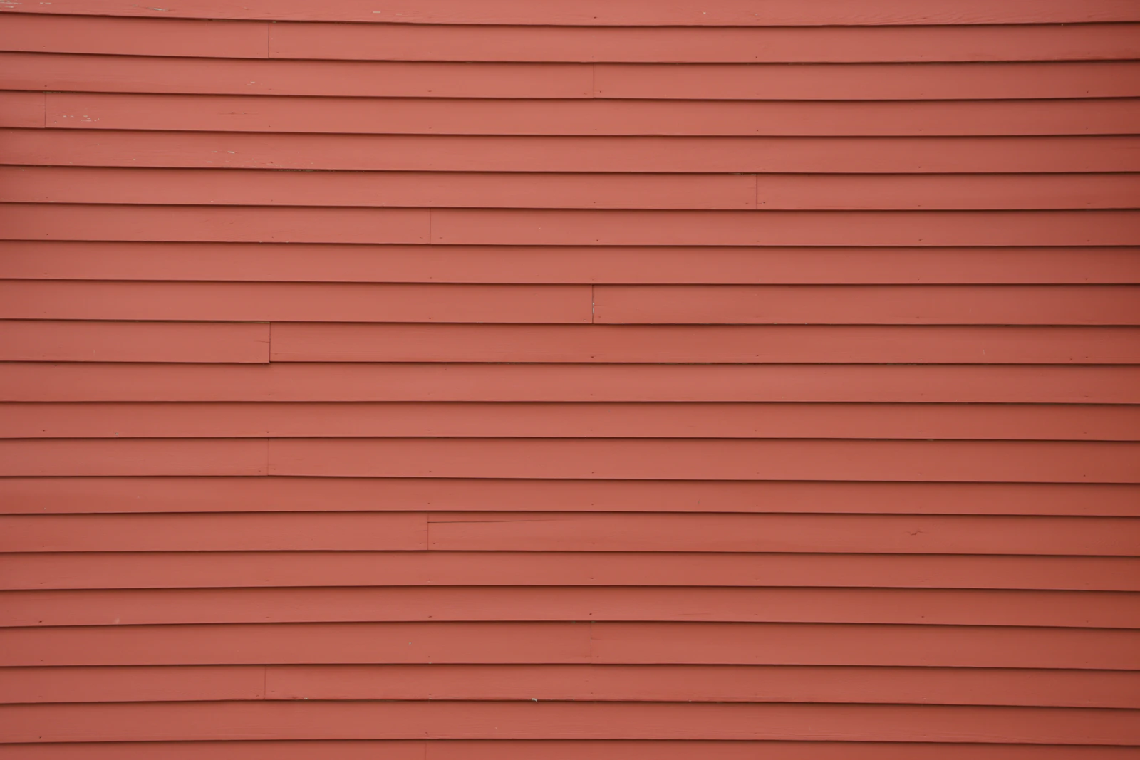 Precision Exteriors Restoration inspecting hail-exposed exterior cladding on a Denver area home