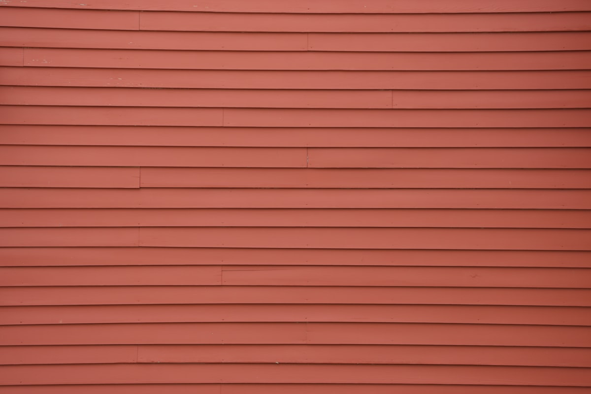 Close-up of terracotta-colored horizontal siding