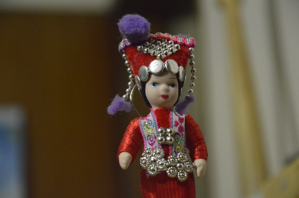 girl in red and white dress doll