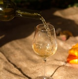 clear wine glass with brown liquid