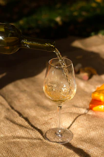 clear wine glass with brown liquid
