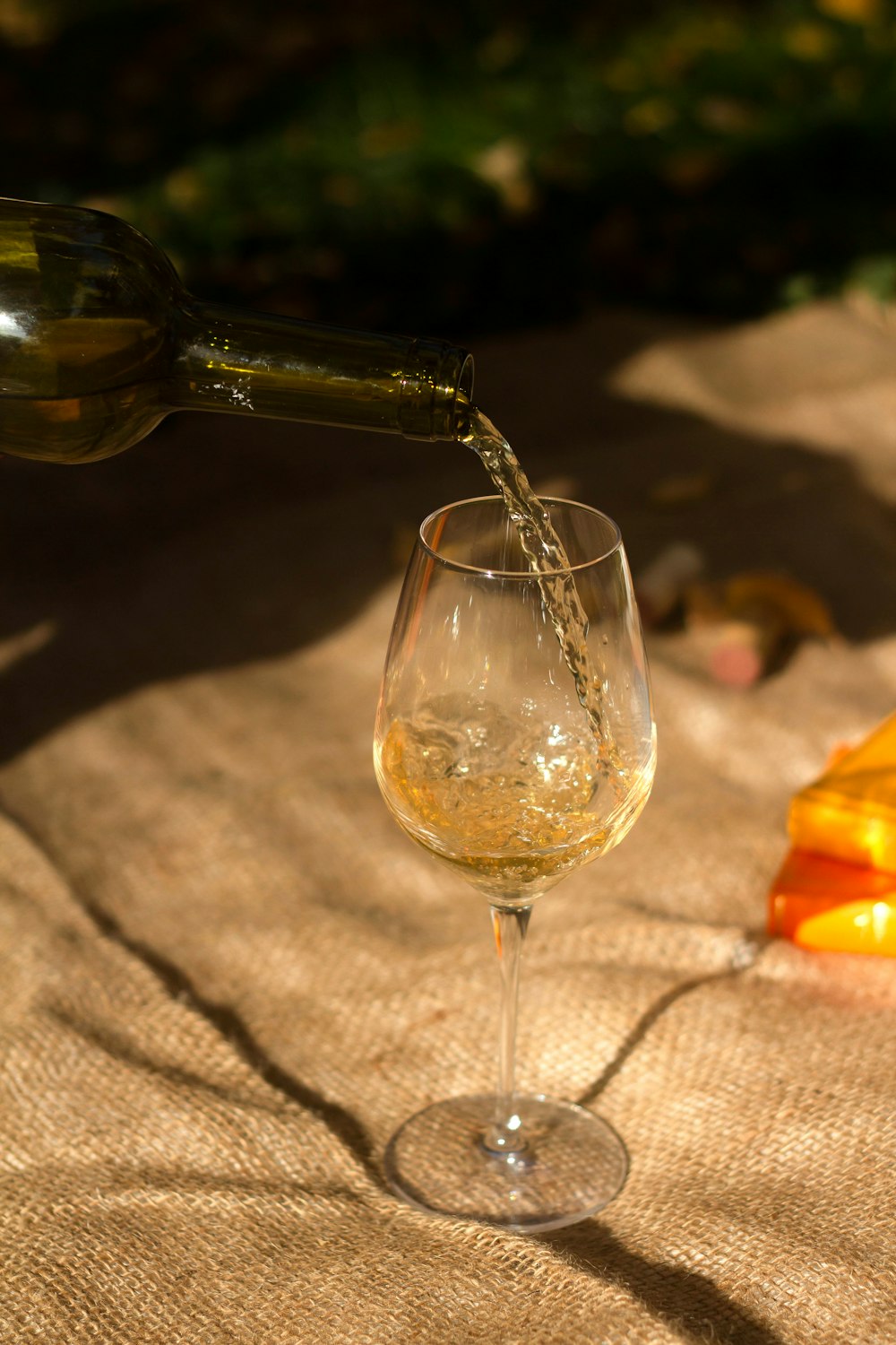 clear wine glass with brown liquid