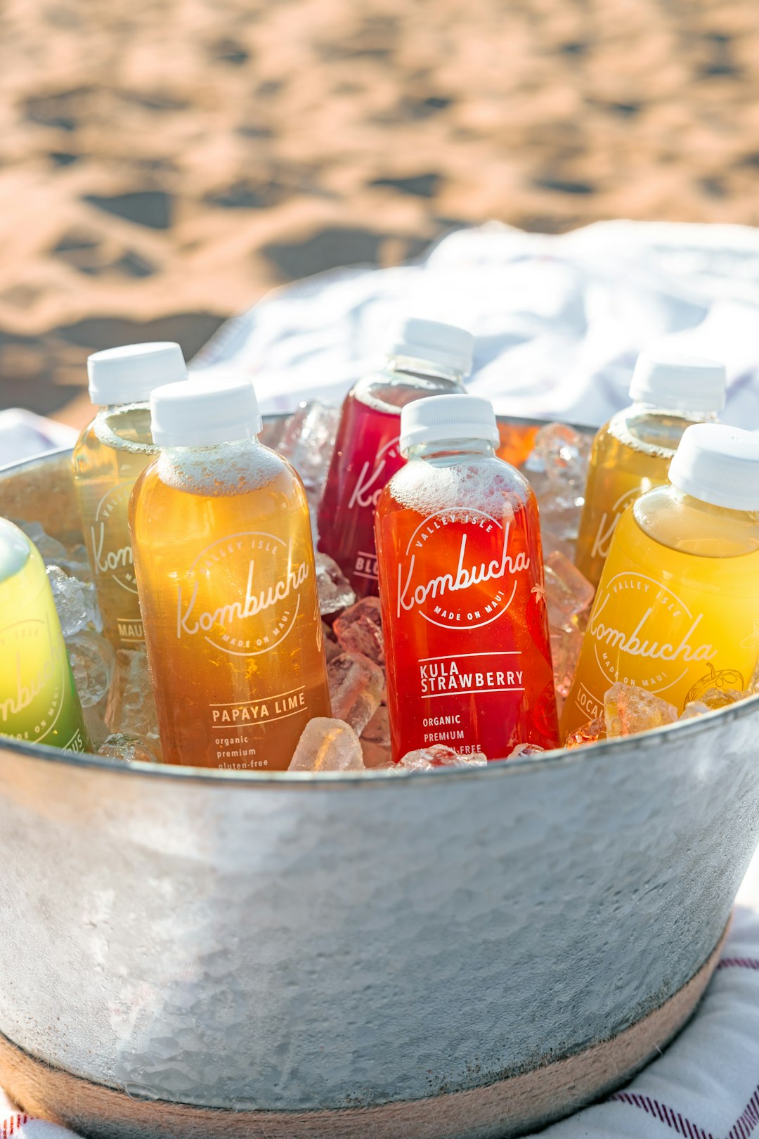  orange juice bottle on stainless steel bucket cooler