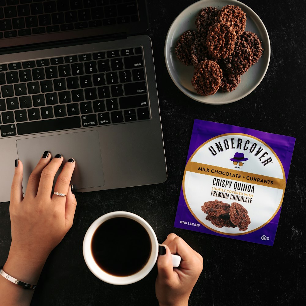 person holding UNKs chocolate chip cookies and cream