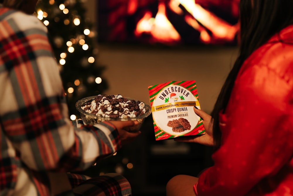 person holding UNKs chocolate chip cookies