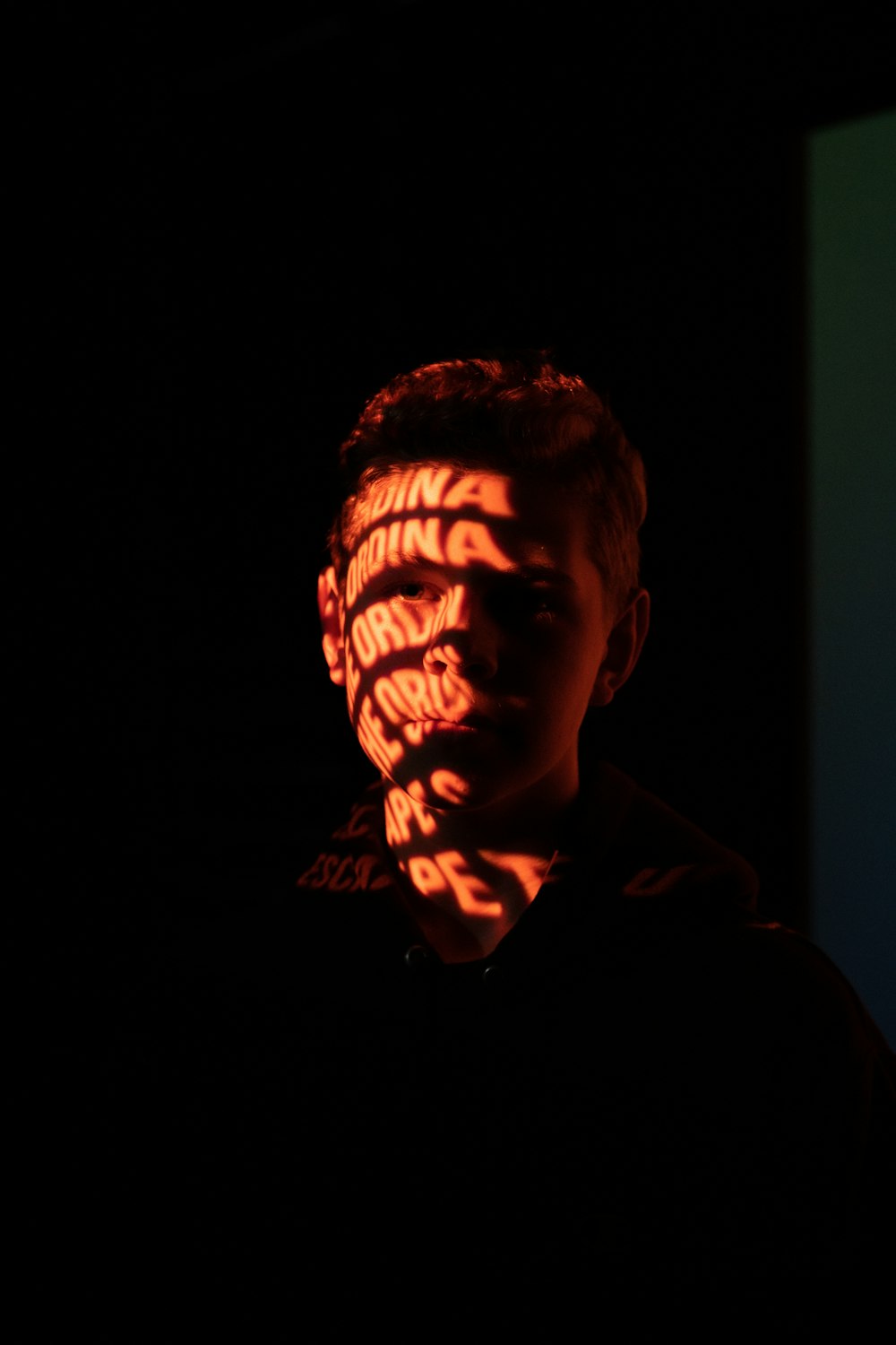 man in black hoodie with face paint