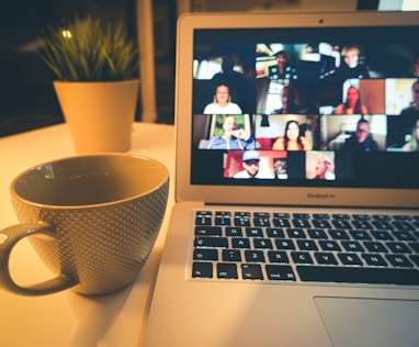 macbook air displaying woman in white shirt