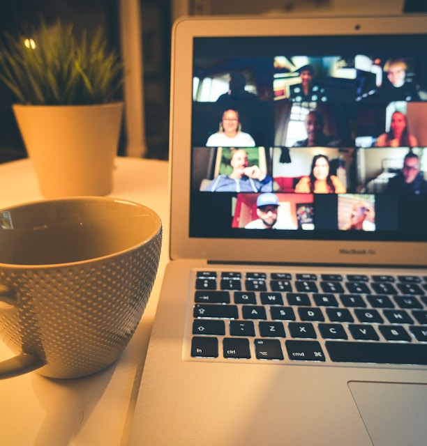 macbook air displaying woman in white shirt