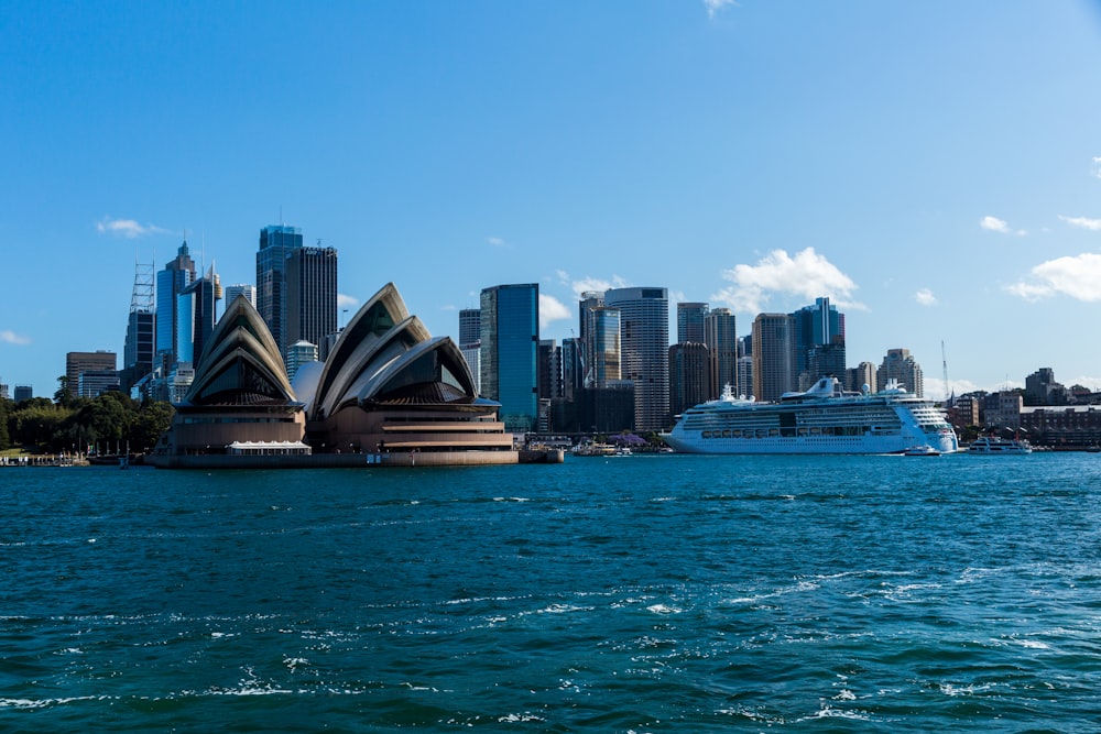 city skyline across body of water during daytime