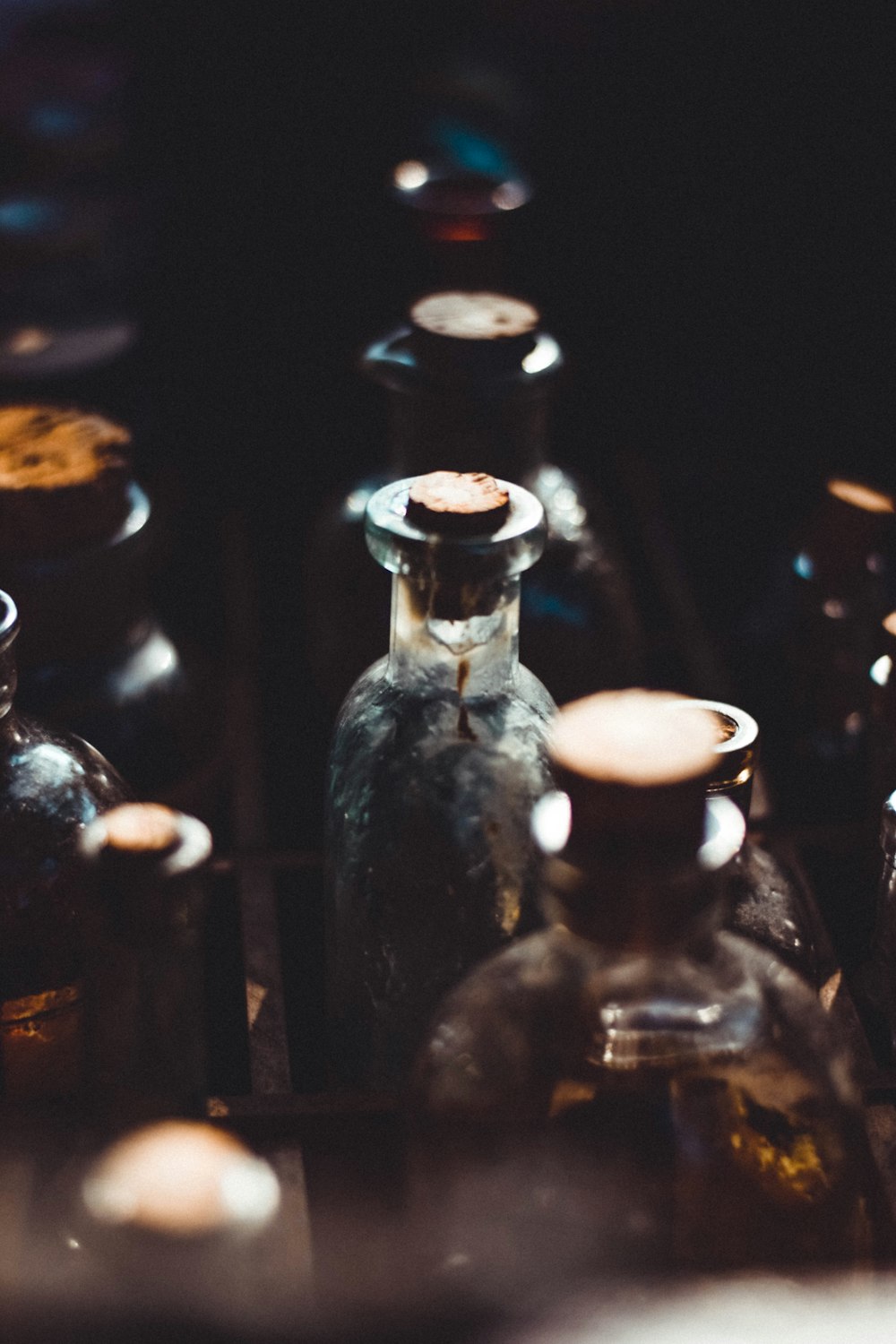 selective focus photography of clear glass bottles