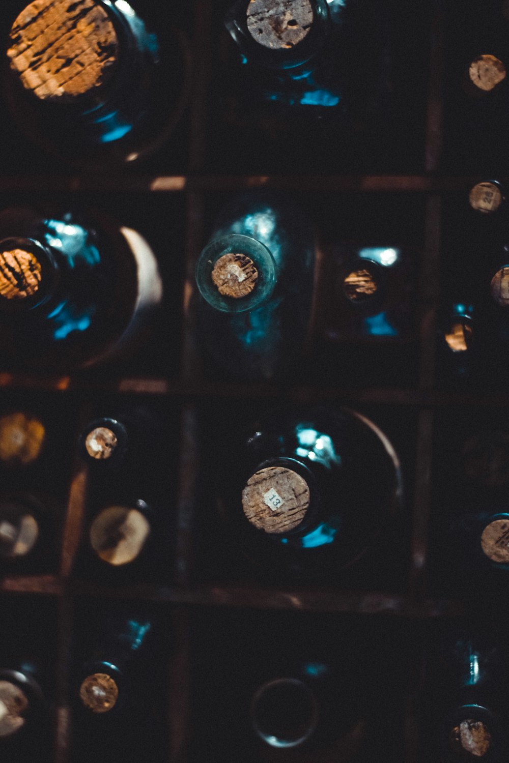 bottles on brown wooden shelf