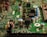 A close-up view of an electronic circuit board featuring various components such as capacitors, resistors, and integrated circuits. The board is mostly green with metallic elements, showing a complex array of electronic architecture.