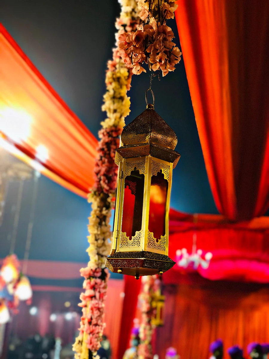 A warm hanging lamp glowing in a dim room