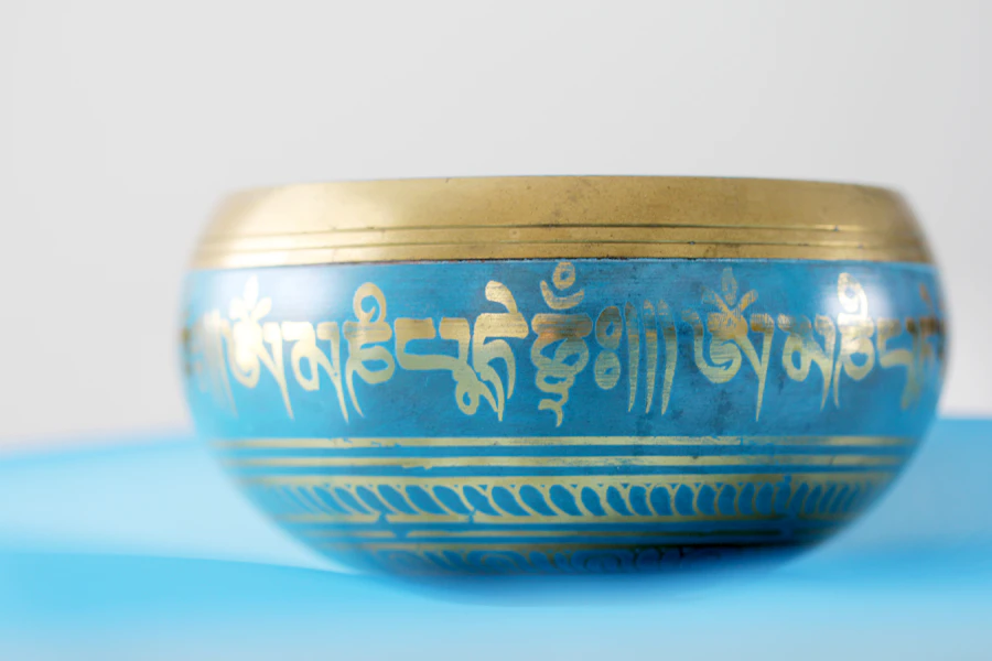 Hands holding a Tibetan singing bowl