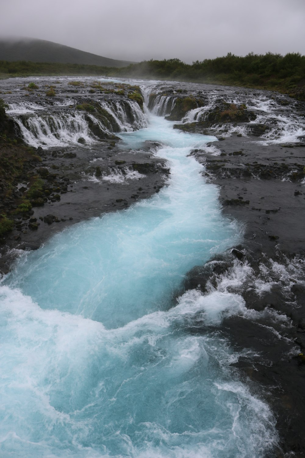 water falls on green grass