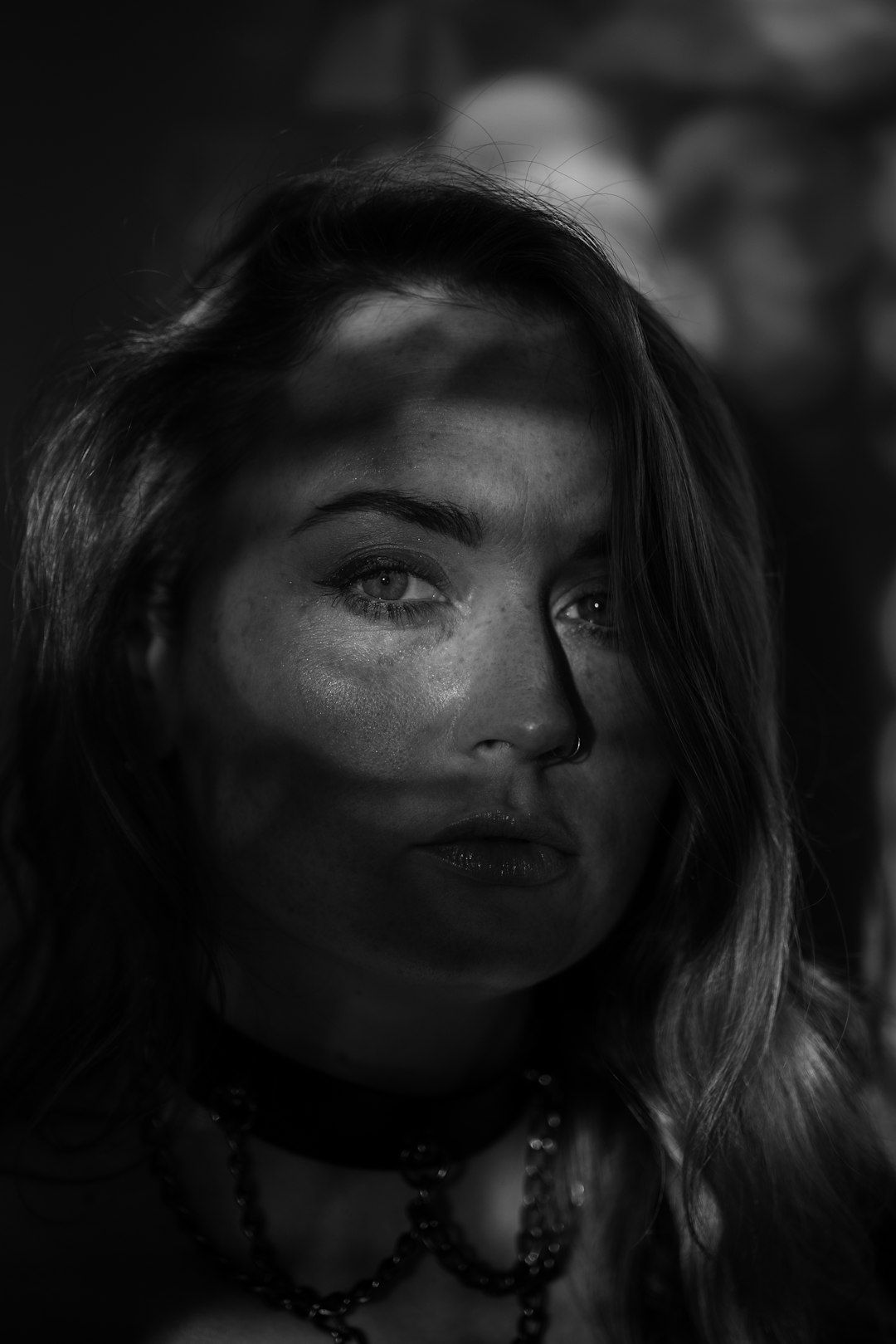 grayscale photo of womans face