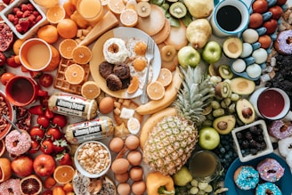 A colorful array of breakfast packages displayed on a wooden table with fresh ingredients.