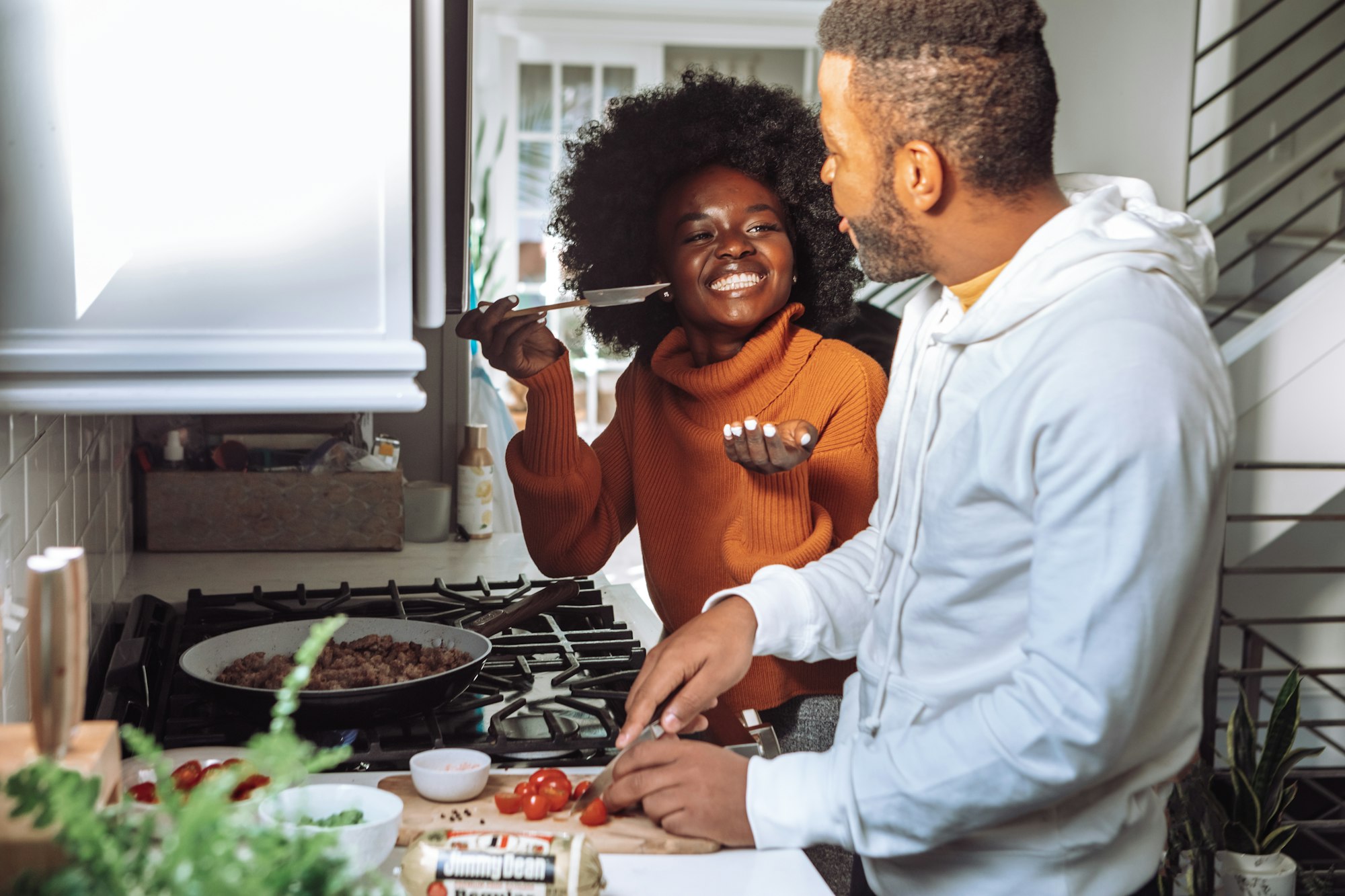 African American woman and man cooking