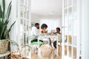 people sitting on chairs in front of table