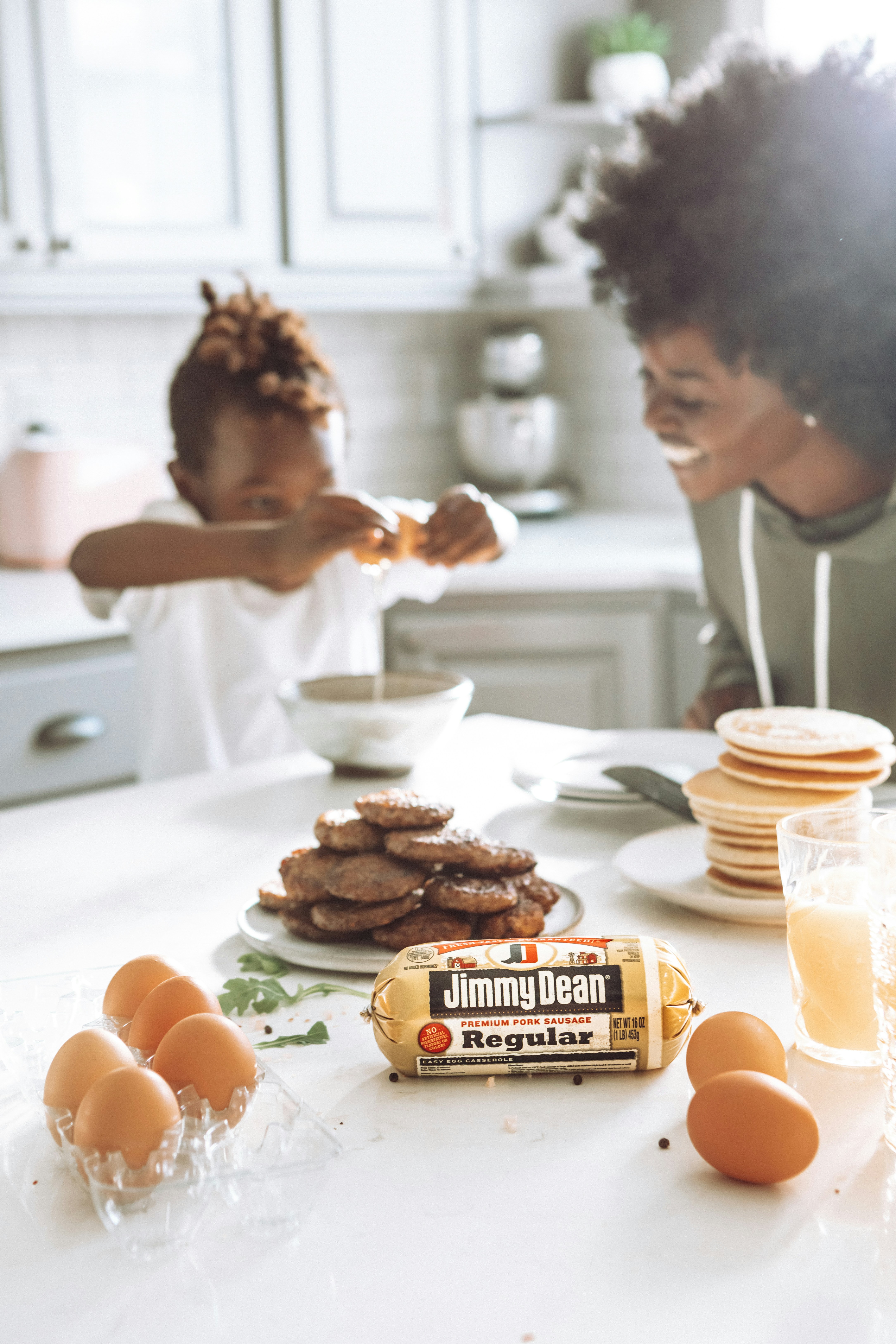 woman in white shirt holding brown bread