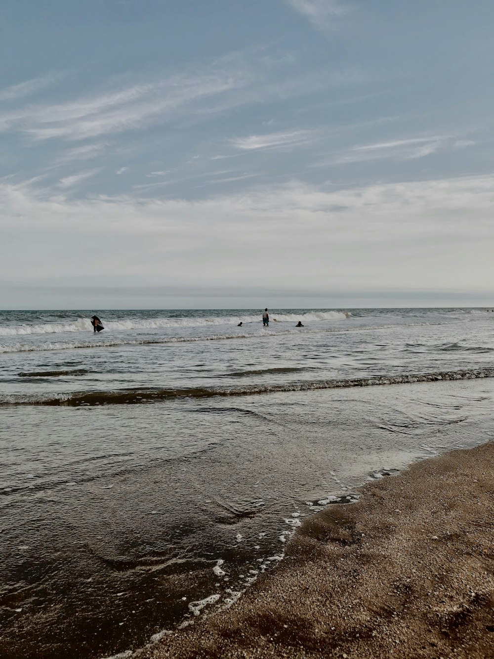 person in sea shore during daytime