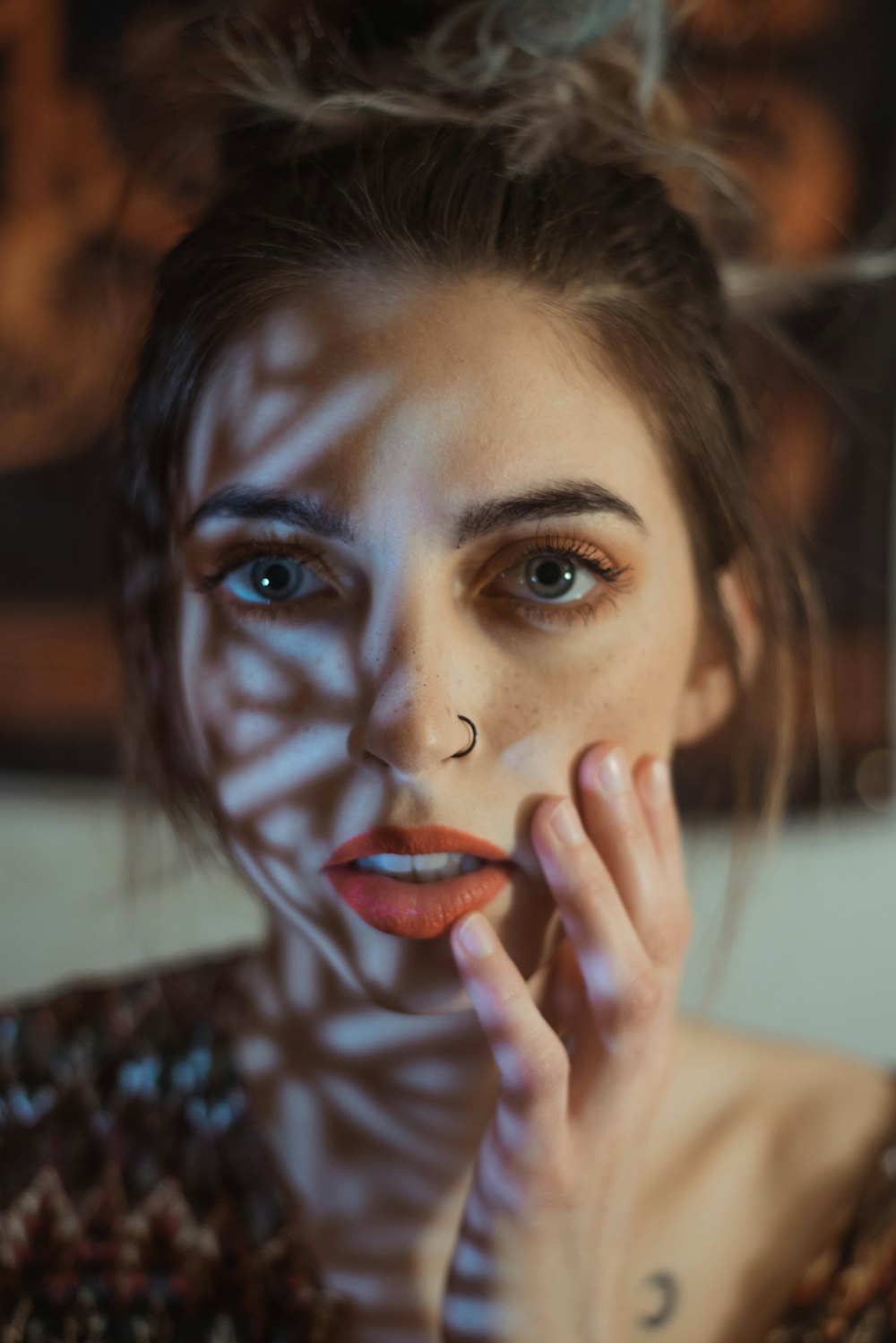 woman in black and white shirt with red lipstick