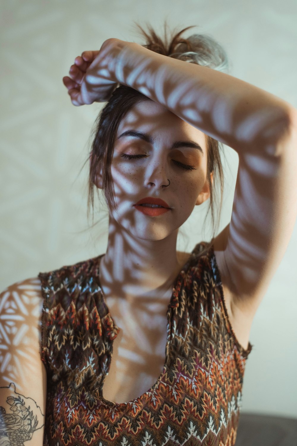 woman in black and brown sleeveless top