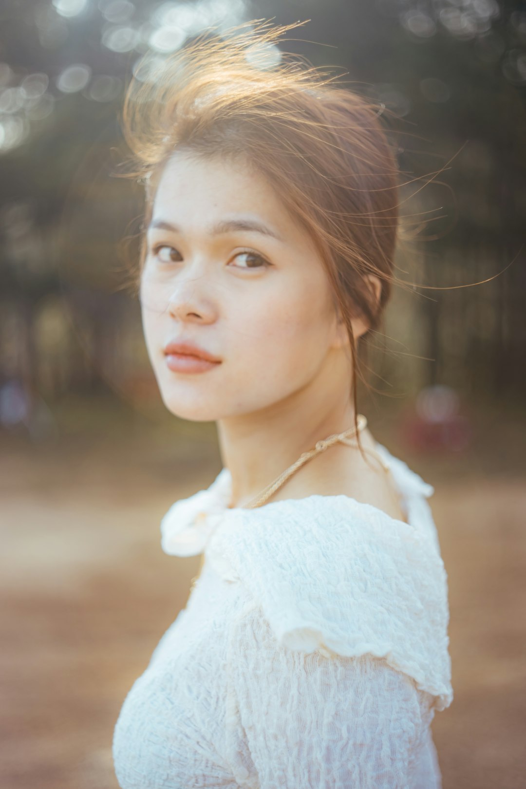 woman in white knit shirt