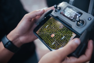 Drone surveying a construction site with visible mapping overlay on screen