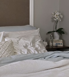 white and gray floral bed linen