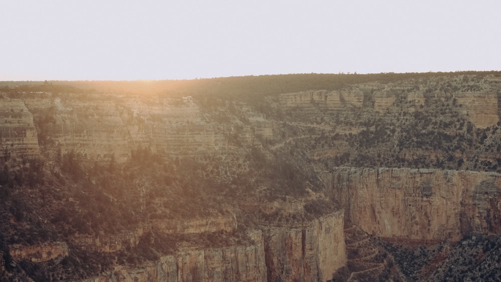 brown and gray rock formation under white sky during daytime