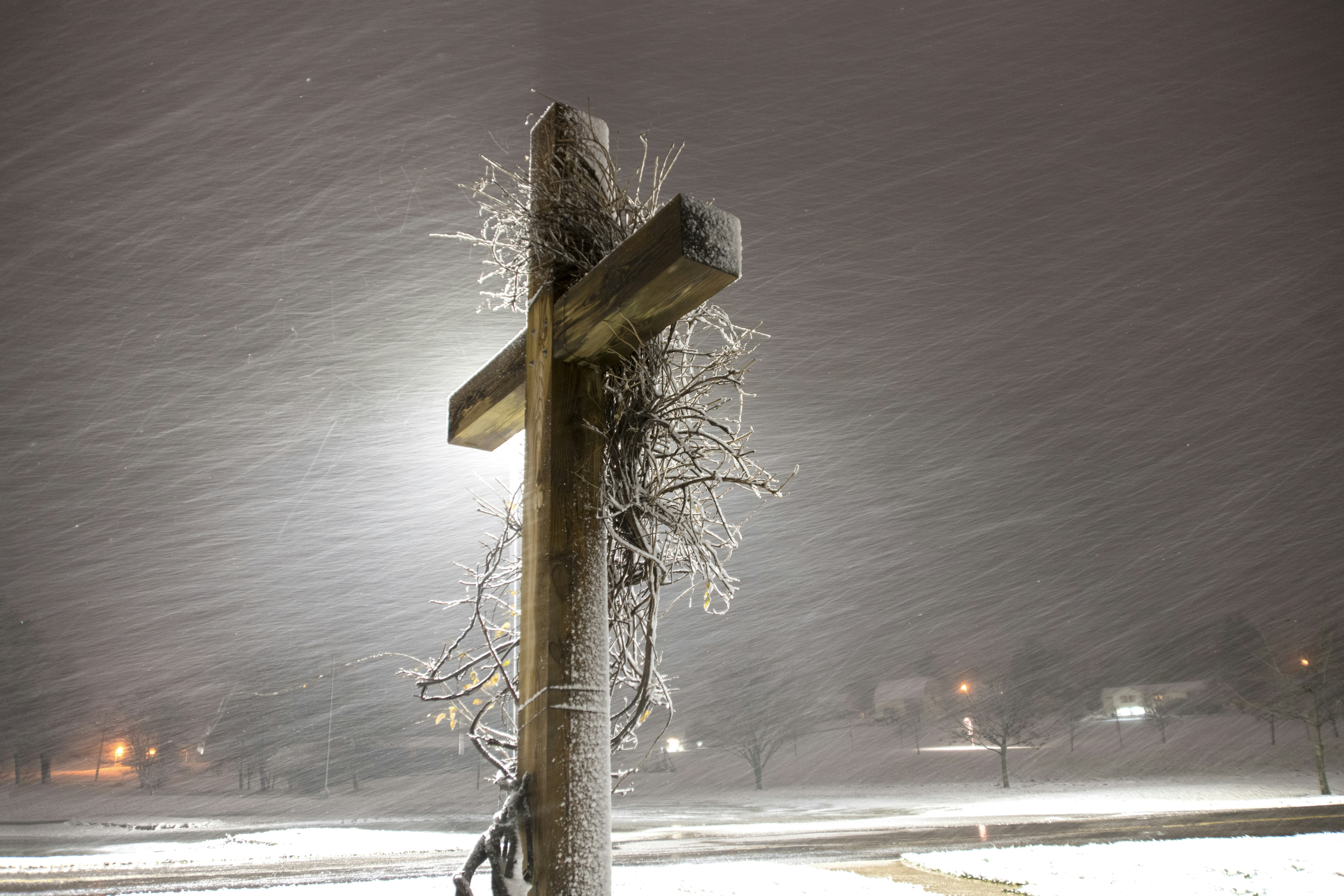 brown wooden post with snow on top during daytime