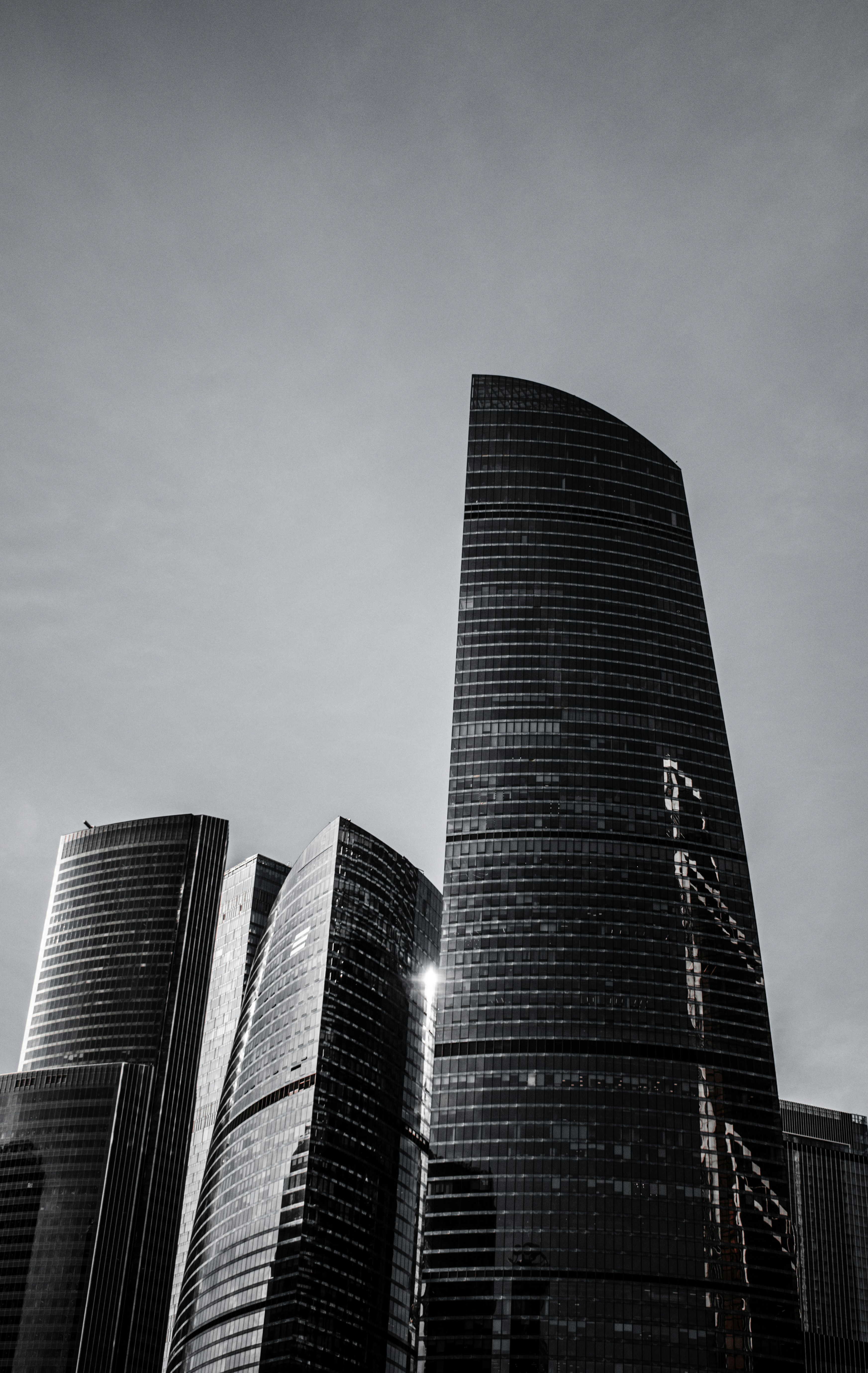Gray high rise building under gray sky photo – Free Grey Image on Unsplash