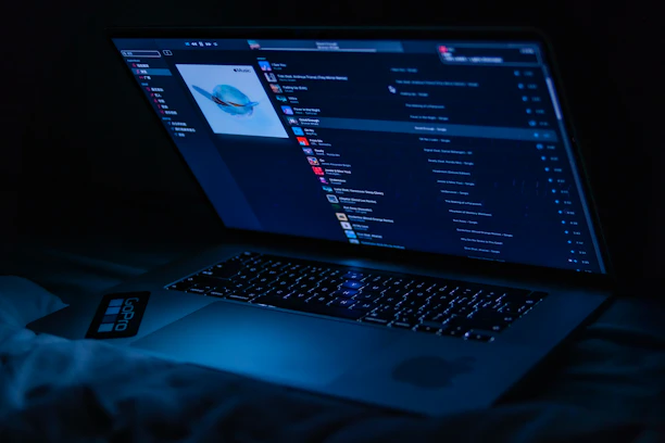 A sleek dark-themed interface showing a playlist with glowing waveform animations.