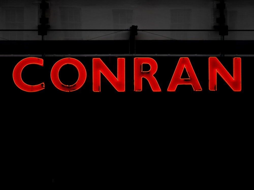 a red sign that says conran on it