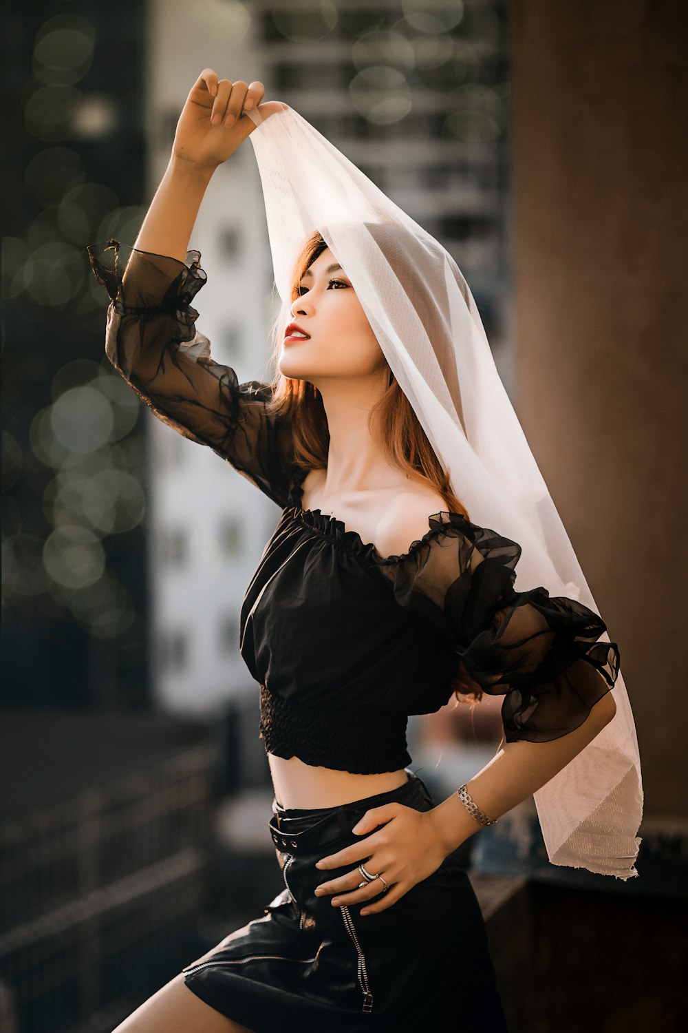 woman in black crop top and white hijab