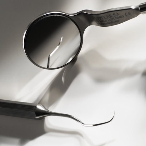 black framed eyeglasses on white textile