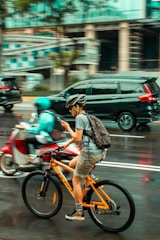 A city commuter using an urban mobility app on a bike