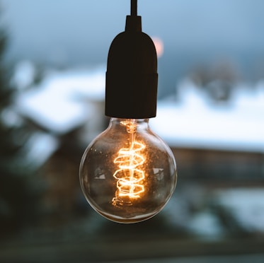 selective focus photography of light bulb